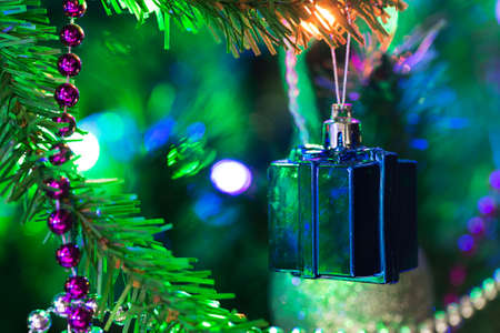 Christmas blue present box baubles on a treeの写真素材