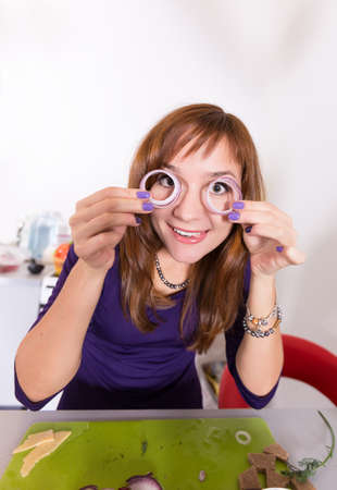 Young pretty woman housewife cookingの写真素材
