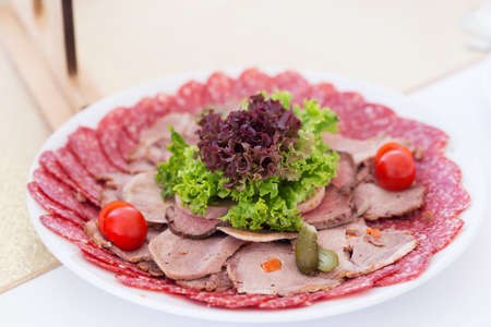 Served table layout with meat snack plateの写真素材