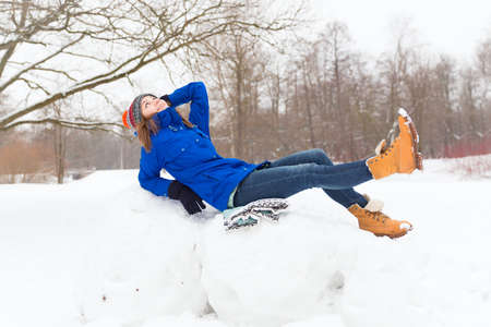 Winter woman have fun outdoors in forestの写真素材