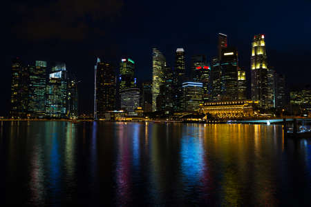 Landscape of the Singapore financial district and business buildings in lights at night outdoorsの写真素材