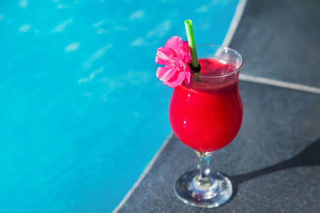 Water melon red fresh juice smoothie drink cocktail near swimming poolの写真素材