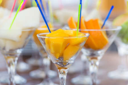 Fresh fruit cuts in martini glasses for partyの写真素材
