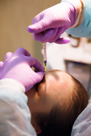 Pretty woman makes standart beauty injections for youth effectの写真素材