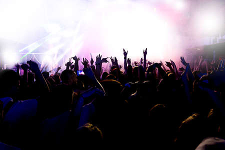 silhouettes of a massive crowd at the party concert club music happyの写真素材