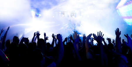 silhouettes of a massive crowd at the party concert club music happyの写真素材