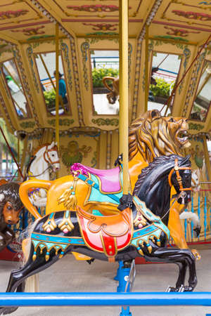 Pretty carousel adventure in an amusement entertainment parkの写真素材