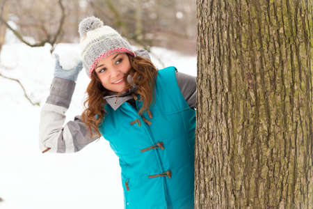 Pretty young winter woman have fun outdoorsの写真素材