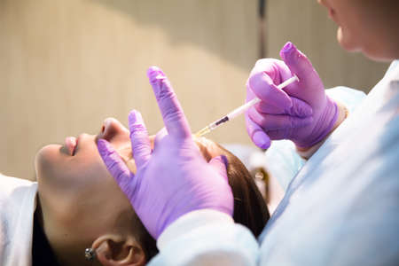 Pretty woman makes beauty injections for youth effectの写真素材