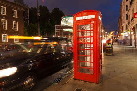 United Kingdom, England, London - 2016 June 17: Popular tourist Red phone booth in night lights illuminationのeditorial素材