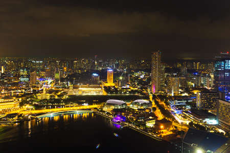 Landscape of the Singapore financial district and business building in evening lights from sands SkyPark observation deckの写真素材