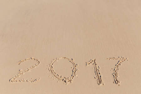 New 2016 2017 Year sign on a sea coast sandの写真素材
