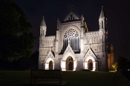 Popular tourist St Albans abbey church in night lights illumination in London, England, United Kingdomの写真素材