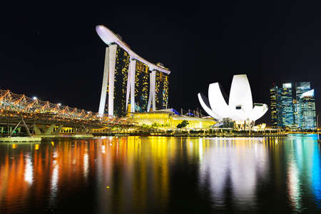 Singapore, Singapore - 15 January 2016: Landscape of Marina Bay hotel, bridge, museum and financial district at nightのeditorial素材
