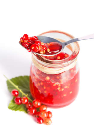 Red current homemade jam on a white backgroundの写真素材