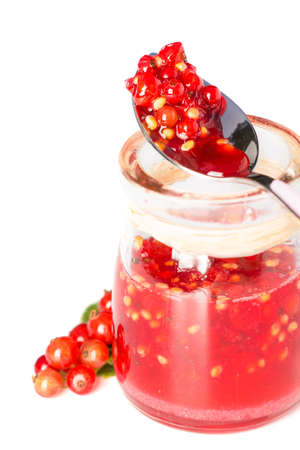 Red current homemade jam on a white backgroundの写真素材