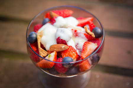 Fresh yogurt with fruits and muesli for breakfastの写真素材