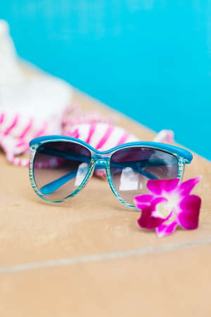 Sunglasses orchid flower colorful swimwear poolの写真素材