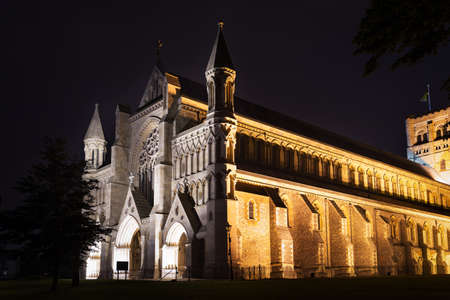 Popular tourist St Albans abbey church in night lights illumination in London, England, United Kingdomの写真素材