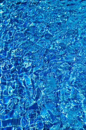 Water surface in turquoise swimming pool - holiday tropical background conceptの写真素材