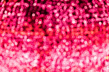 Blur bokeh red unfocused Christmas lights backgroundの写真素材