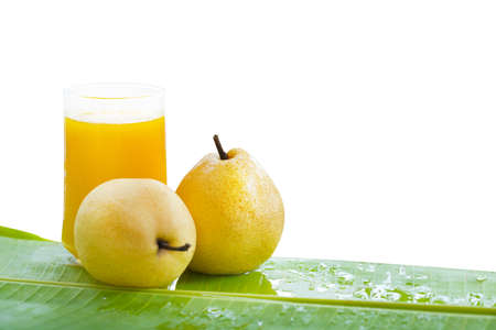 Fresh yellow pear tropic fruit summer refreshment smoothie shake drink on whiteの写真素材