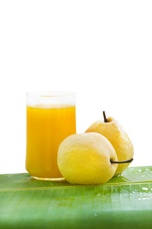 Fresh yellow pear tropic fruit summer refreshment smoothie shake drink on whiteの写真素材