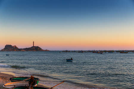 Vietnam Mui Ne village fishing boats and ships in sunset lightの写真素材