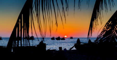 Vietnam Mui Ne village fishing boats and ships in sunset lightの写真素材