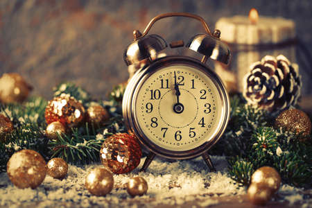 Christmas countdown to the new year. Clock and balls and fir spruce branches. Holiday composition.の写真素材