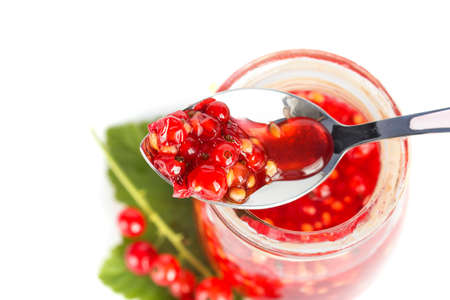 Red current homemade jam on a white backgroundの写真素材
