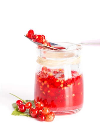 Red current homemade jam on a white backgroundの写真素材
