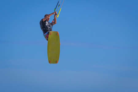 Young atletic man riding kite surf on a sea in Vietnamの写真素材