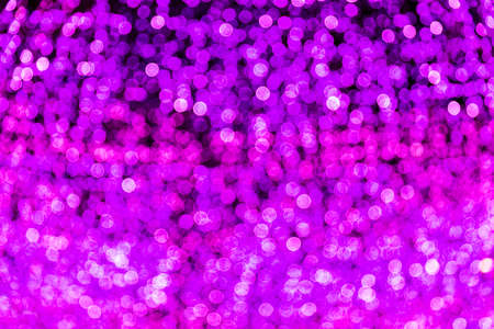 Blur bokeh purple, violet unfocused Christmas lights textured backgroundの写真素材