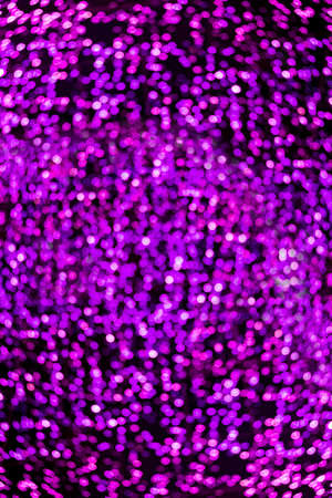 Blur bokeh purple, violet unfocused Christmas lights textured backgroundの写真素材