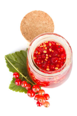 Red current homemade jam on a white backgroundの写真素材