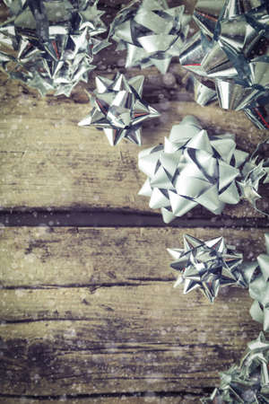 Present gift packaging bows on wooden background Christmas New Year compositionの写真素材