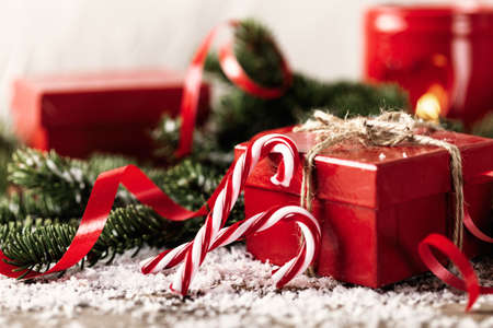 Red present gift box on wooden background Christmas New Year compositionの写真素材