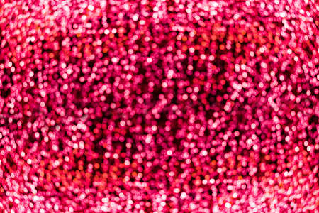 Blur bokeh red unfocused Christmas lights textured backgroundの写真素材