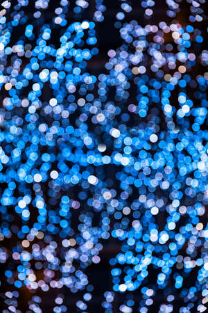 Blur bokeh blue unfocused Christmas lights backgroundの写真素材