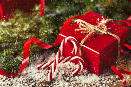 Red present gift box on wooden background Christmas New Year compositionの写真素材