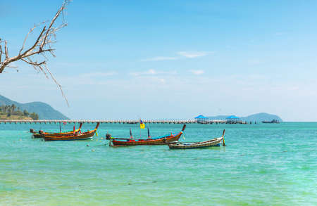 Thailand, Phuket island Andaman Sea with traditional Thai long tail boats in the Rawai bay.の写真素材