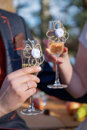 Couple of just married bride anf groom toast with champagne glassesの写真素材
