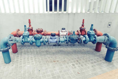  Water pipes joined with valves of the water supply system on a streetの写真素材