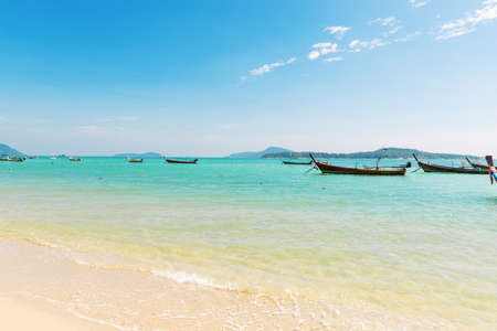 Andaman Sea with traditional Thai long tail boats in the Rawai bay, Phuket island, Thailandの写真素材