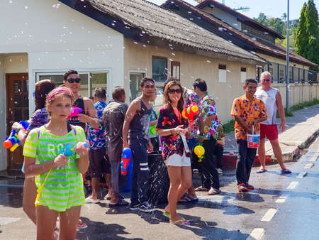 Phuket, Thailand - April 13, 2018: Crowd of People participate in water battle fights with guns and ladles celebrate traditional Thai New Year - Songkran Festival, photo was taken on mobile phone Samsung Note 8のeditorial素材