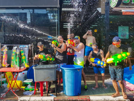 Phuket, Thailand - April 13, 2018: Crowd of People participate in water battle fights with guns and ladles celebrate traditional Thai New Year - Songkran Festival, photo was taken on mobile phone Samsung Note 8のeditorial素材
