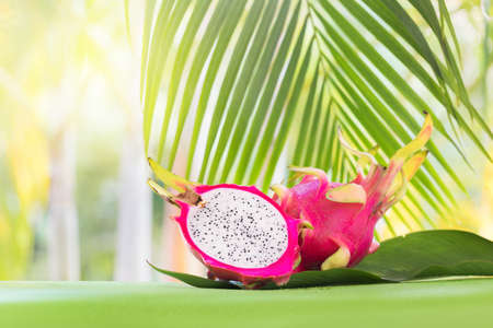 Fresh, tasty tropic, exotic dragon pitahya dragon fruit near palms