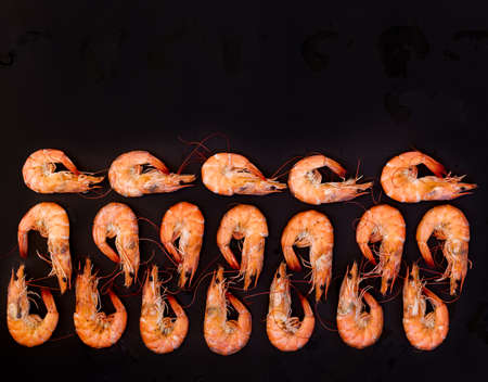 Perfect cooked prawns shrimps and text space note book top view flat lay layoutの写真素材