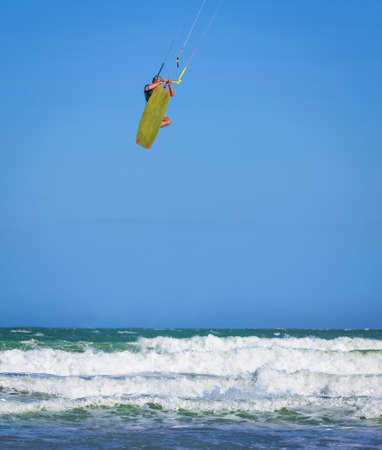 Young athletic man riding kite surf on a sea in Vietnamの写真素材